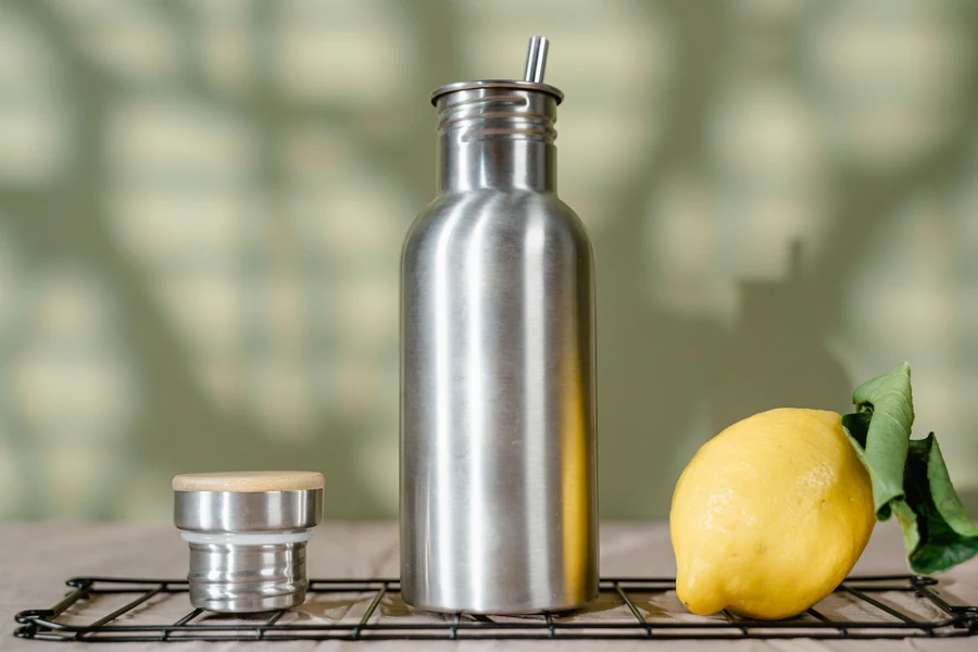 Illustrative stainless steel reusable bottle in a clean tabletop setting