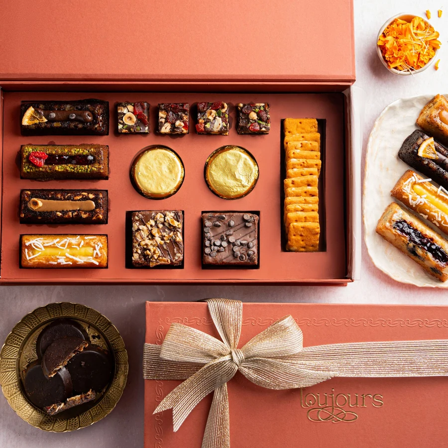 Illustrative festive gift box with an arranged selection of sweets